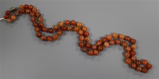 An early 20th century banded agate and other hardstone bead necklace, 80cm.